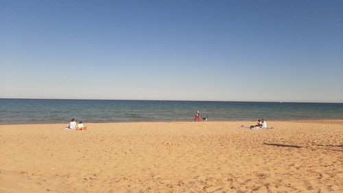 Scenic view of beach against clear sky