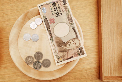 High angle view of coins on table