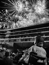 Low angle view of firework display at night