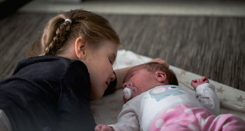 High angle view of girl with baby