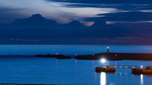 Scenic view of sea against sky at dusk