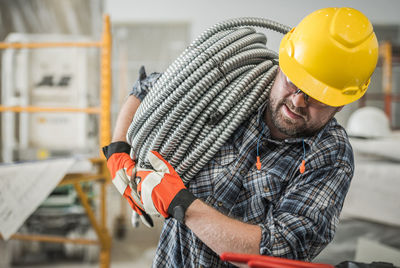 Side view of man working in workshop