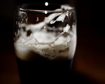 Close-up of beer glass on table