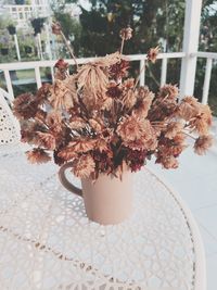 Close-up of wilted flower pot on table