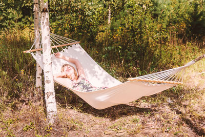 Woman lying on field