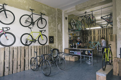 Mechanics working in a custom-made bicycle store