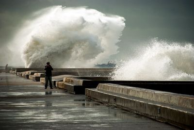 Man standing on water against the sky