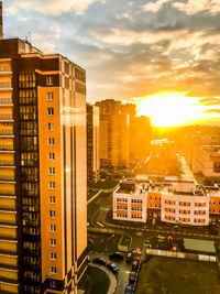 High angle view of buildings against sky during sunset