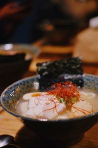 Close-up of fish in bowl on table