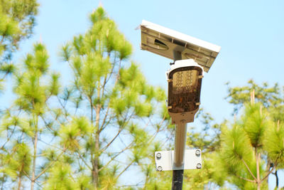 Low angle view of birdhouse against sky
