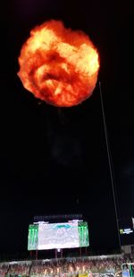 Illuminated light against sky at night
