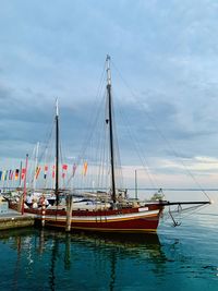 Boats moored at harbor