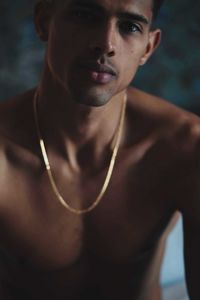 Portrait of young man in the dark room