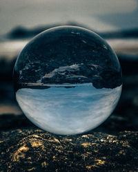 Close-up of crystal ball on glass