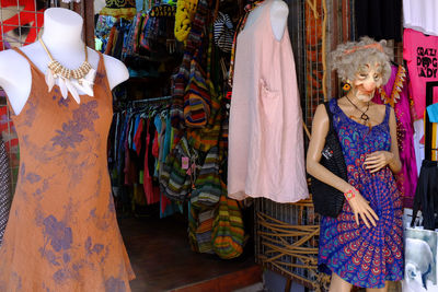 Woman standing in store for sale in market