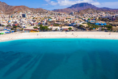 Aerial view of sea against townscape