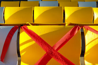 Yellow outdoor seating after rain