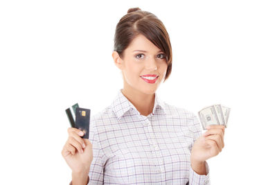 Portrait of a smiling young woman over white background