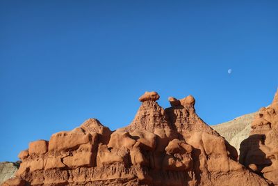 Landscape of oddly shaped rock formations in goblin valley state park in utah