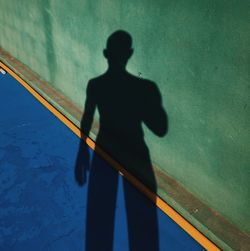 High angle view of man shadow on wall