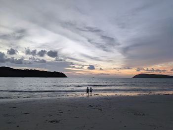 Scenic view of beach against sky during sunset
