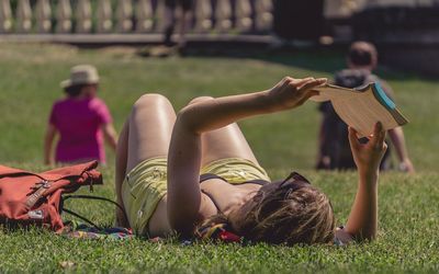 Man relaxing on grassy field