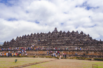 Group of people in front of historical building