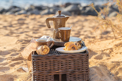 Coffee cups on table at beach