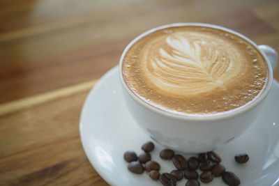 High angle view of cappuccino on table