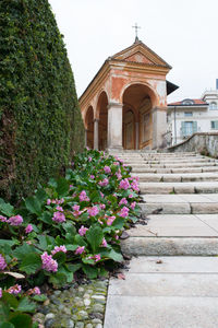 Stairs to beautiful corridor with paintings at baveno, italy. church of st gervasio and protasio