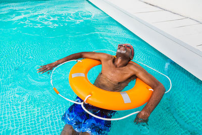 Man swimming in pool