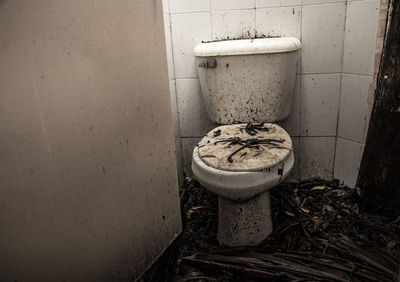 Close-up of abandoned bathroom