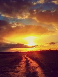 Scenic view of road against sky during sunset