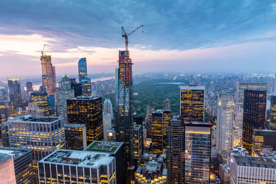 Aerial view of illuminated buildings in city