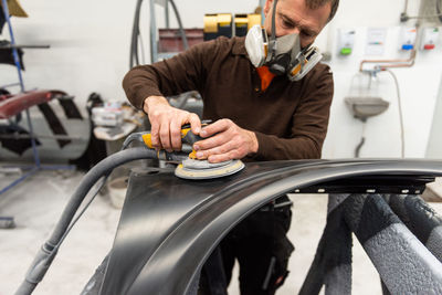 Engineer making car in workshop