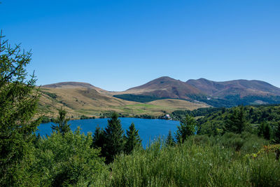 Scenic view of mountains against clear blue sky