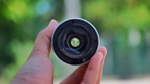 Close-up of hand holding camera