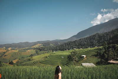 Scenic view of agricultural field against sky