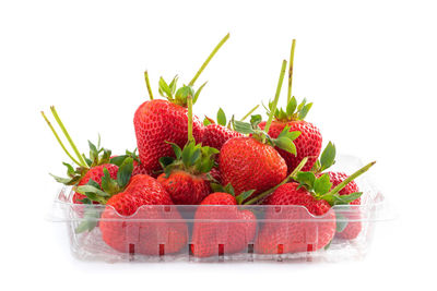 Close-up of fruits against white background