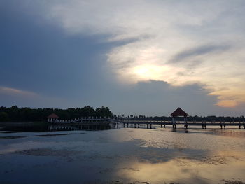 Scenic view of beach against sky during sunset