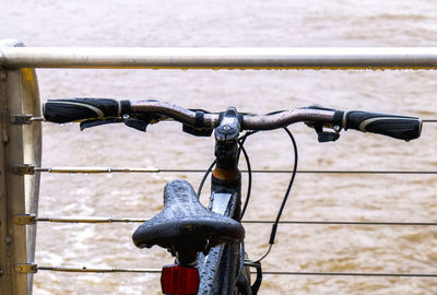 Close-up of bicycle on railing