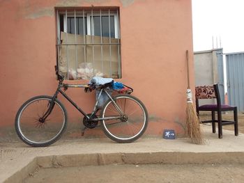 Side view of bicycle against building