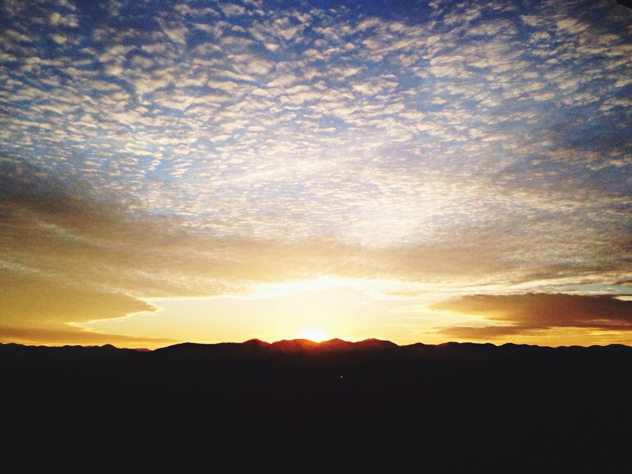 sunset, silhouette, scenics, tranquil scene, beauty in nature, sky, tranquility, landscape, cloud - sky, idyllic, orange color, nature, sun, cloud, dramatic sky, majestic, sunlight, dark, mountain, outdoors