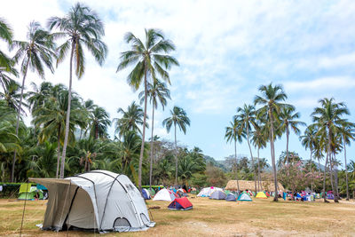 Tents on field at campsite in tayrona national park against sky