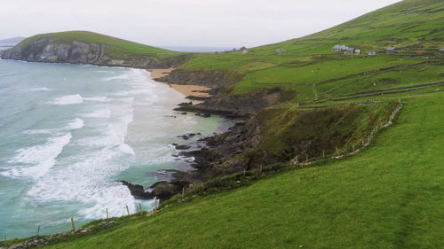 High angle view of land and sea against sky