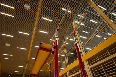 Low angle view of illuminated lighting equipment hanging on ceiling