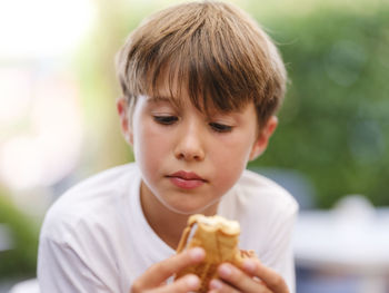 Close-up portrait of boy holding ice cream