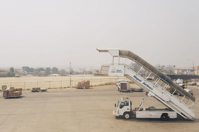 View of airport runway against clear sky