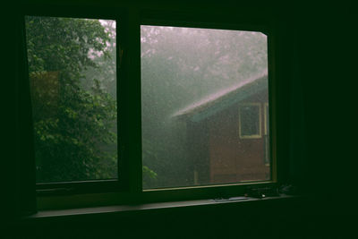 Wet glass window of house