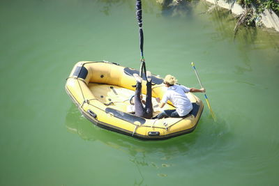 High angle view of man on boat in lake